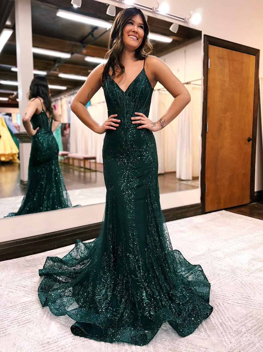 Prom dress features exposing boning in the bodice and back and an all over glitter pattern with a stunning train