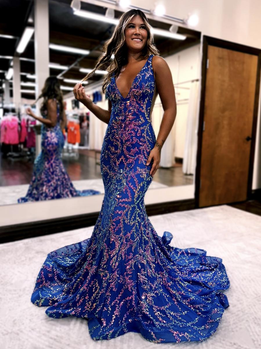 Prom dress is fully sequined in a beautiful pattern! Featuring a v-neck plunge and sheer side detailing